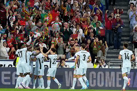 2024-25 Nations League Football Portugal vs Croatia: Portugal players celebrate after Diogo Dalot, obscured, scored the opening goal